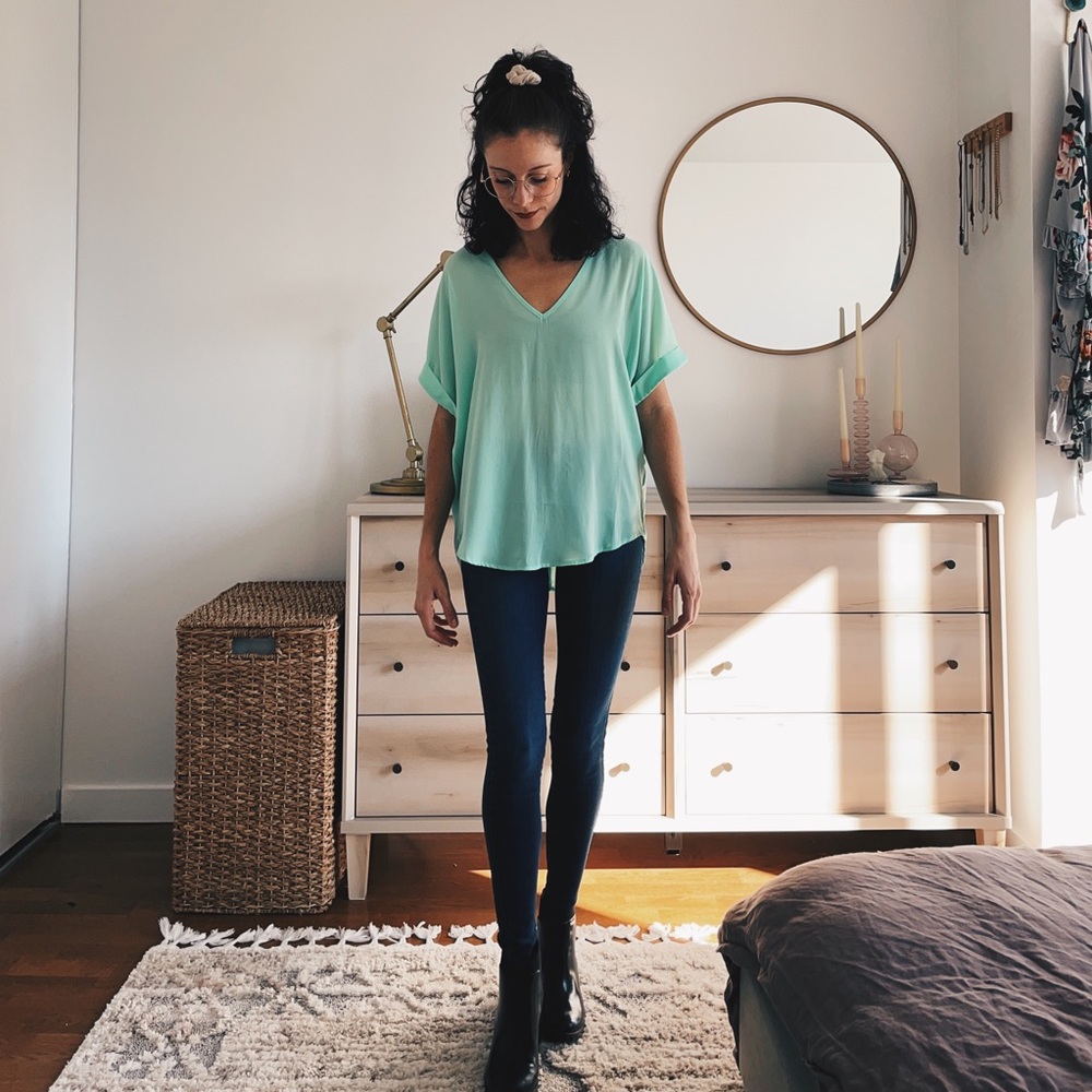 Light teal sheer top.